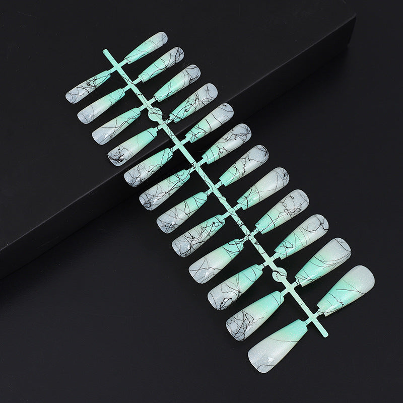 Artificial nails in modern ombre design with marbled accents Acalora