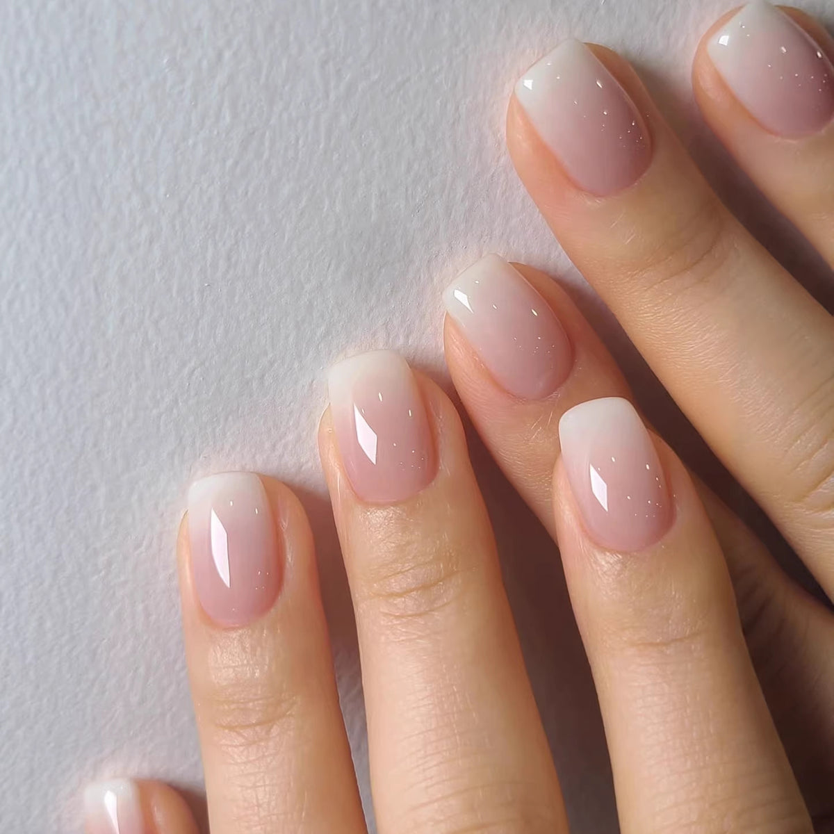 Artificial nails in modern ombre look Acalora