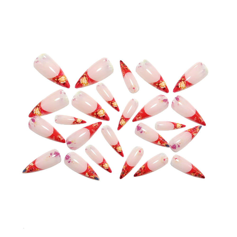 Nail art with sparkling design and extravagant pointed tips Acalora