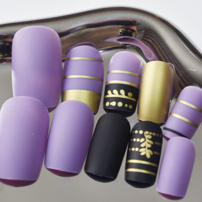 Trendy Press-On Nail Art with Decorative Gold Accents Acalora