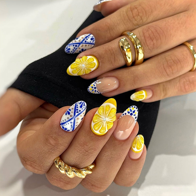 Artificial nail set with glamorous floral designs and creative glitter accents Acalora