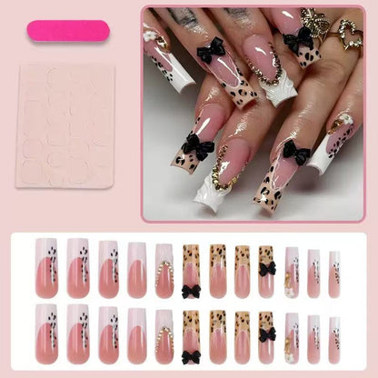 Artistic Press-On Nail Design with Bow and Animal Print Accents Acalora