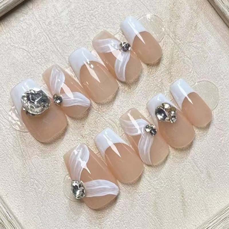 Elegant artificial nail set with delicate decorations and glitter elements Acalora