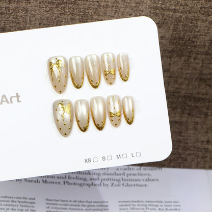 Elegant Press-On Nail Art with Golden Bow Accents Acalora