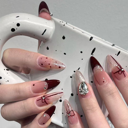 Artificial nail set with elegant bow and glitter details Acalora
