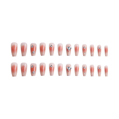 Acrylic nail set with elegant heart and rhinestone decorations Acalora