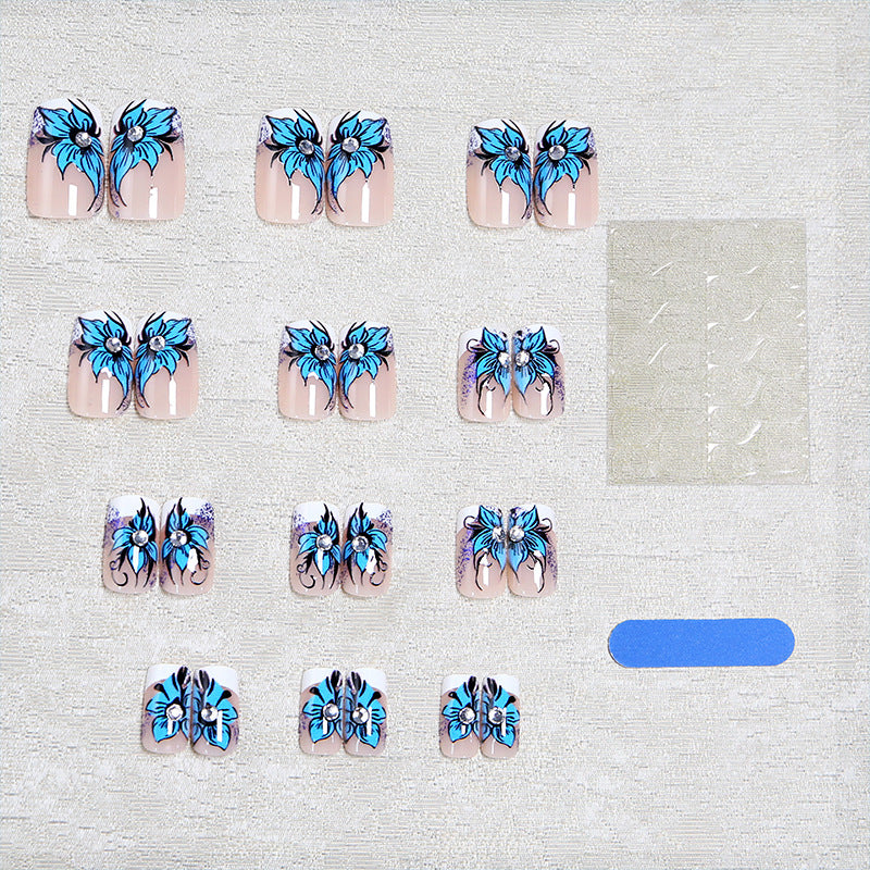 Artificial nail set with intricate floral designs and glitter elements Acalora