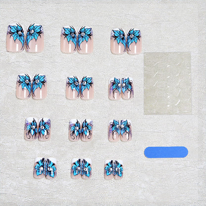 Artificial nail set with intricate floral designs and glitter elements Acalora