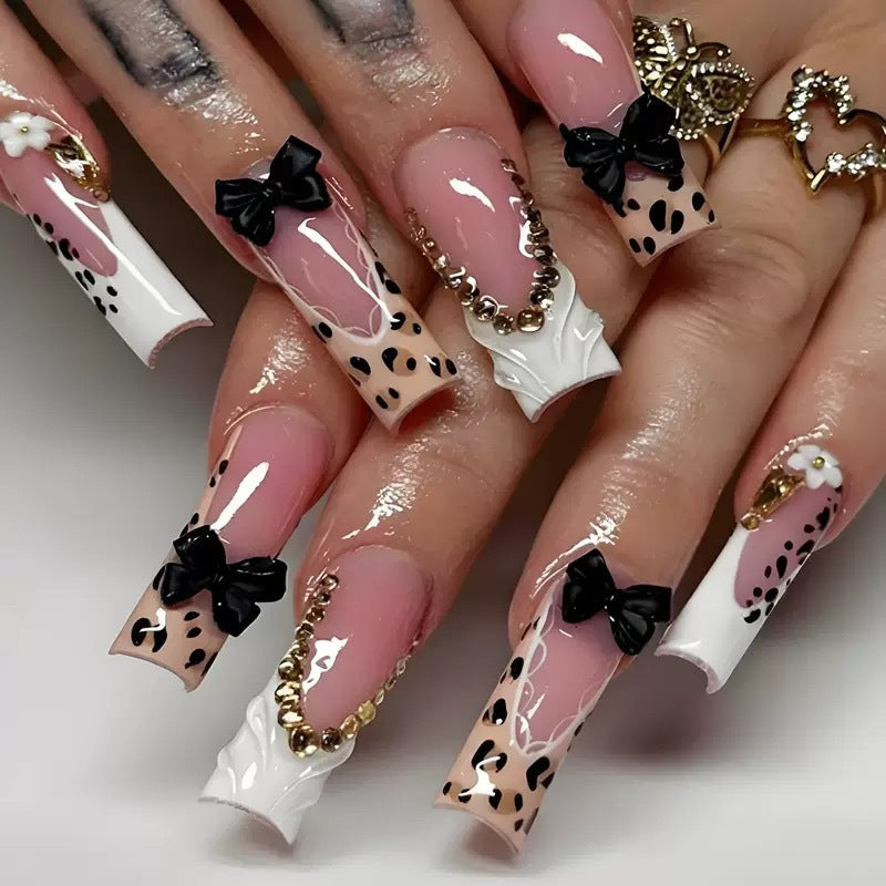 Artistic Press-On Nail Design with Bow and Animal Print Accents Acalora