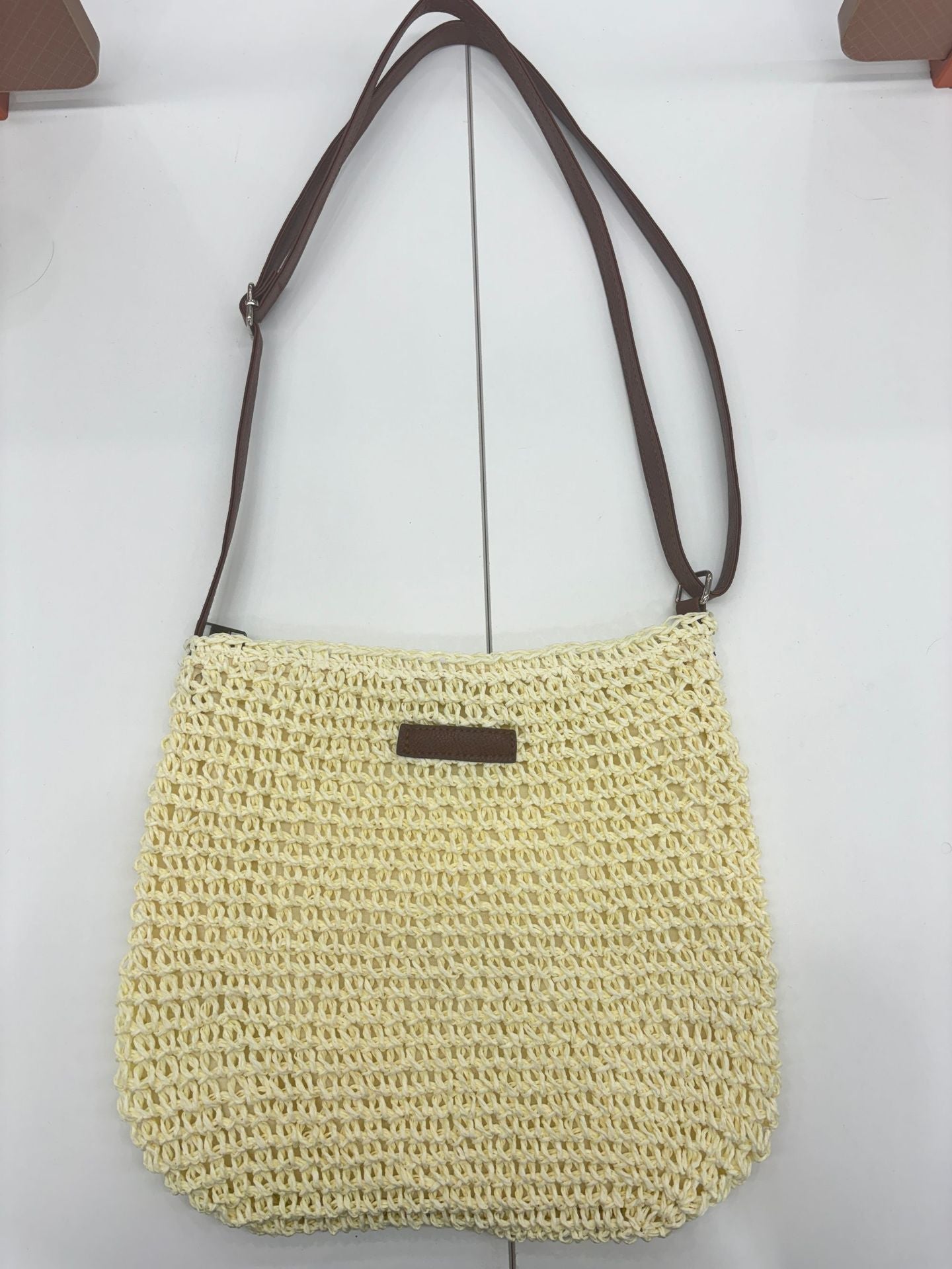 Handwoven shoulder bag with brown leather accent Skanto
