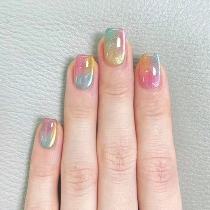 Artificial nails in delicate ombre design with glitter effects Acalora