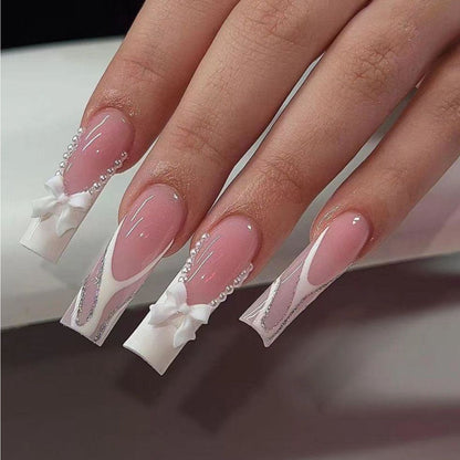 Artificial nail set with elegant bow and pearl decorations Acalora