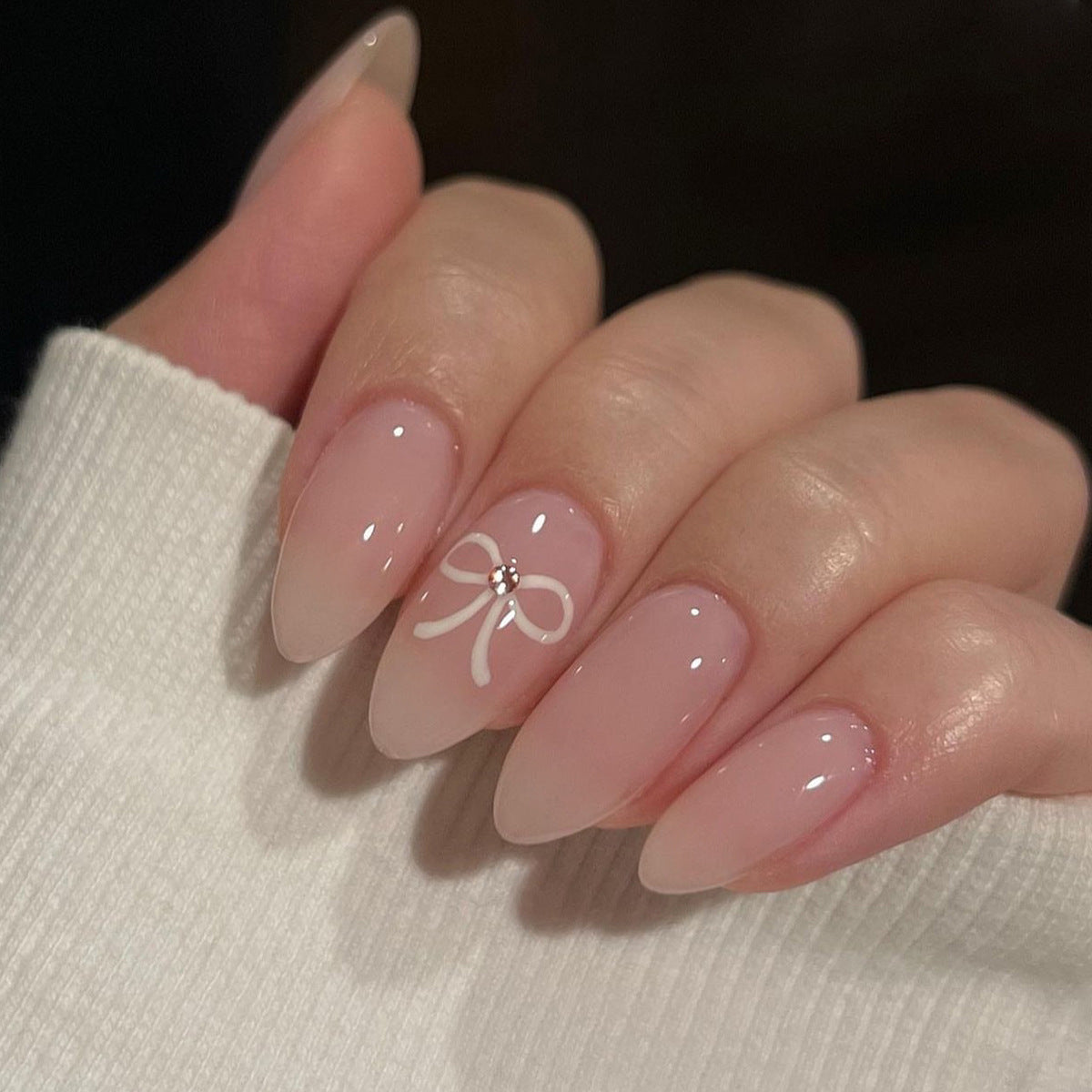 Acrylic nail set with elegant bow accents Acalora