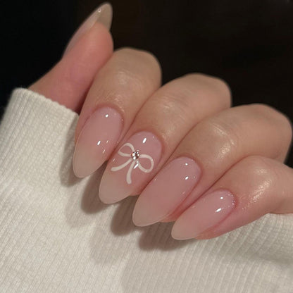 Acrylic nail set with elegant bow accents Acalora