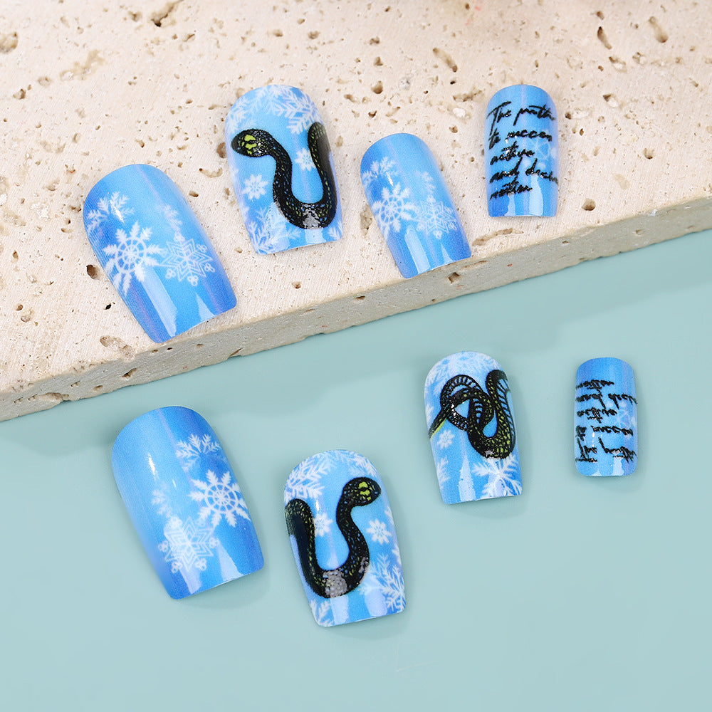 Creative art nails with snowflake and snake motif Acalora