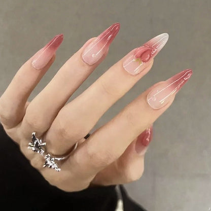 Nail set in elegant ombre design with artistic accents Acalora
