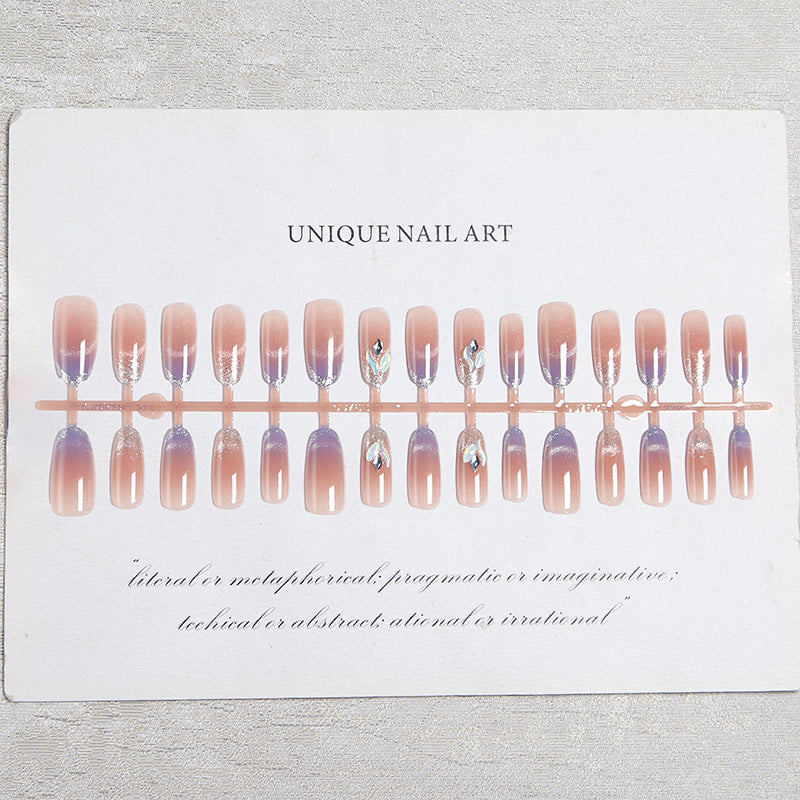 Acrylic nail set with elegant glitter effect and beautified embellishments Acalora
