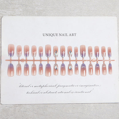 Acrylic nail set with elegant glitter effect and beautified embellishments Acalora