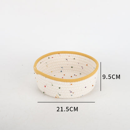 Storage basket made of natural cotton fabric with colorful dots