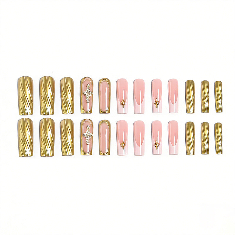 Acrylic nail set with elegant golden embellishments and glamorous accents Acalora