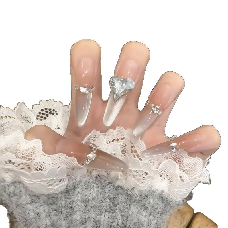 Acrylic nail set with elegant tips and glamorous rhinestone accents Acalora