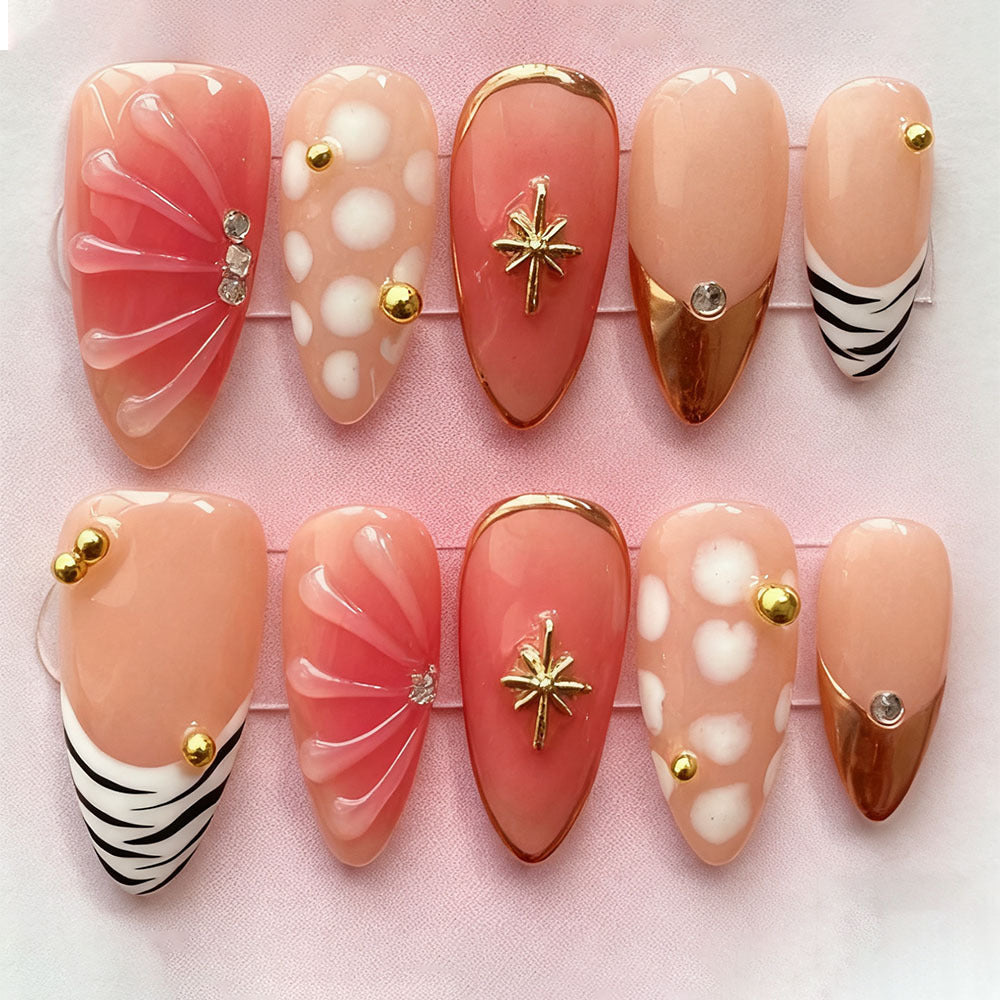 Acrylic nail set with elegant gold design and floral decor Acalora