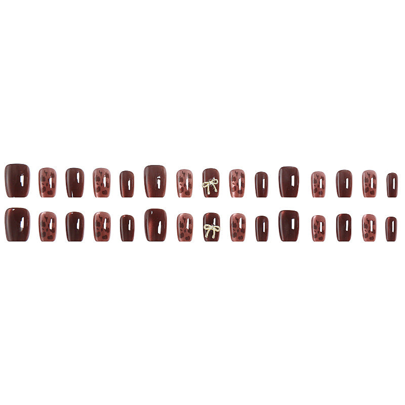 Nail set with elegant leopard pattern and luxurious accents Acalora
