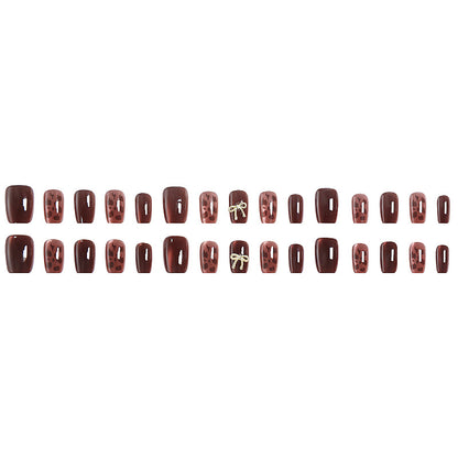 Nail set with elegant leopard pattern and luxurious accents Acalora