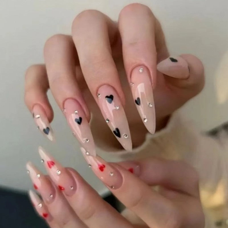 Glamorous artificial nails with heart accents Acalora