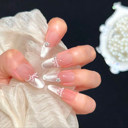 Artificial nail set with elegant bow and rhinestone embellishments Acalora