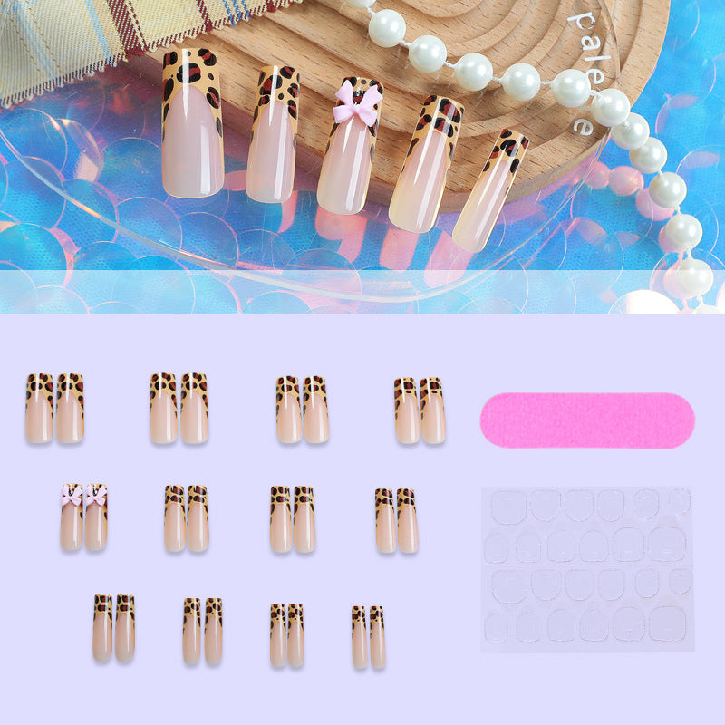 Decorative Stiletto Press-On Nail Art with Animal Print and Bow Accents Acalora