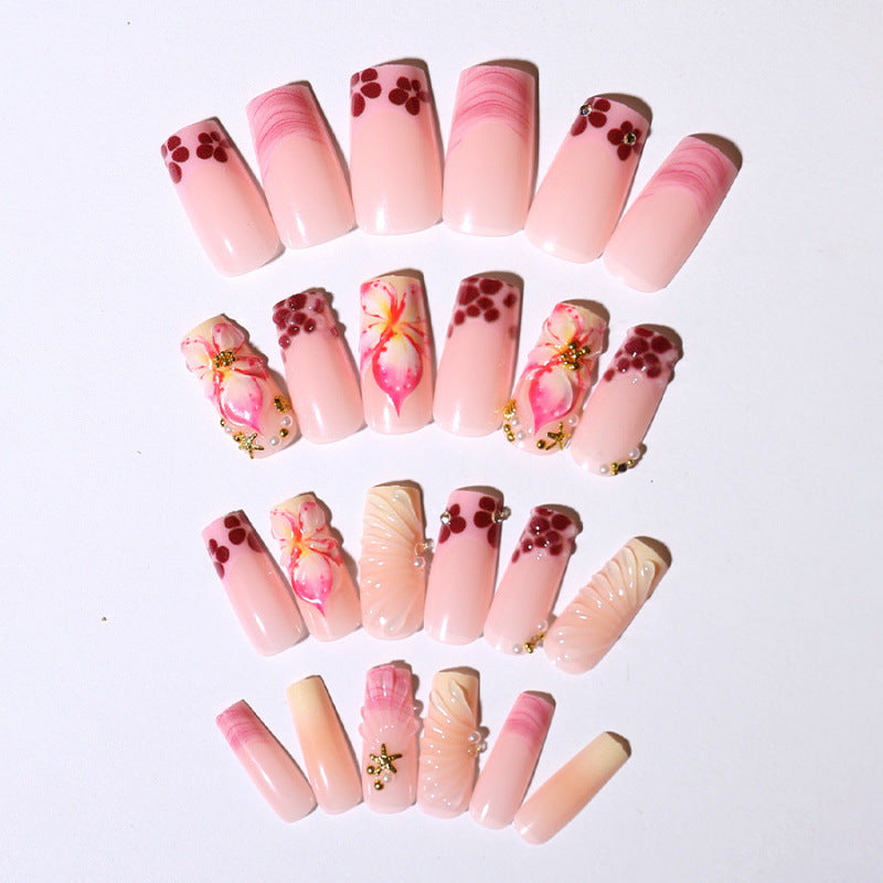 Acrylic nail set with exclusive flower design and sparkling accents Acalora