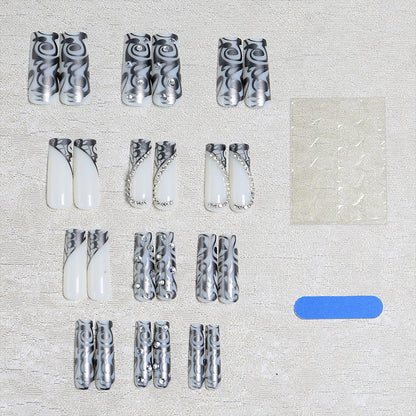 Acrylic nail set with elegant patterns and sparkling accents Acalora