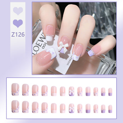 Nail art set with elegant wave patterns and delicate pearl accents Acalora