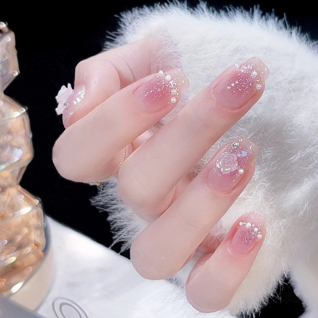 Artificial nail set with sparkling glitter and pearl decorations Acalora