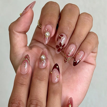 Artificial nail set with glamorous floral designs and creative glitter accents Acalora