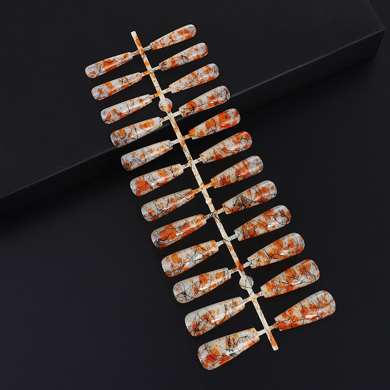 Creative nail art with blood splatter design Acalora