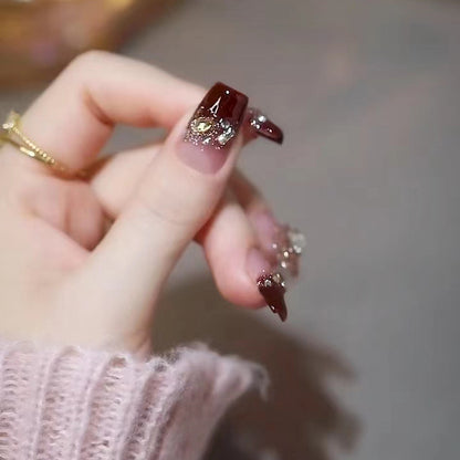 Artificials nails with glitter embellishments and elegant accents Acalora