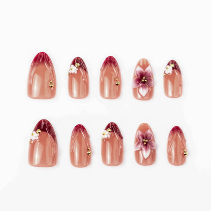 Artificial nail set with floral accents and gold embellishments Acalora