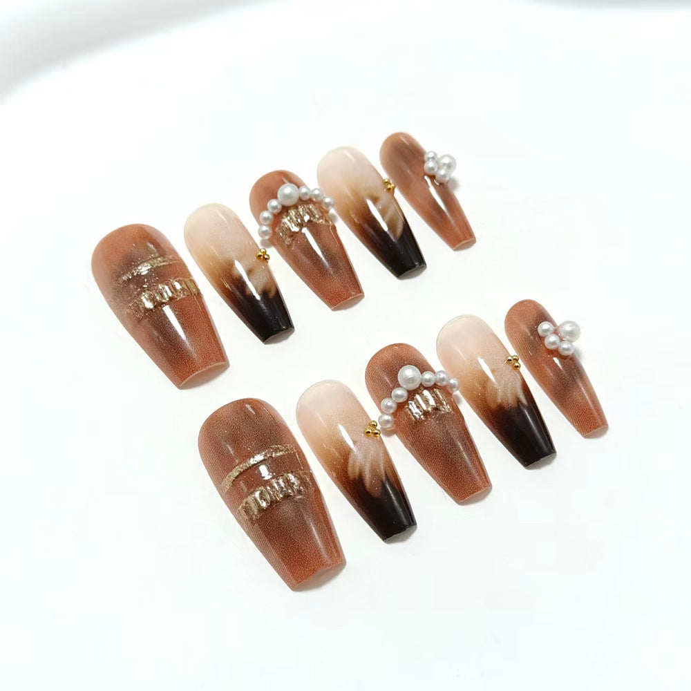 Artificial nails with glamorous gold and pearl embellished accents Acalora