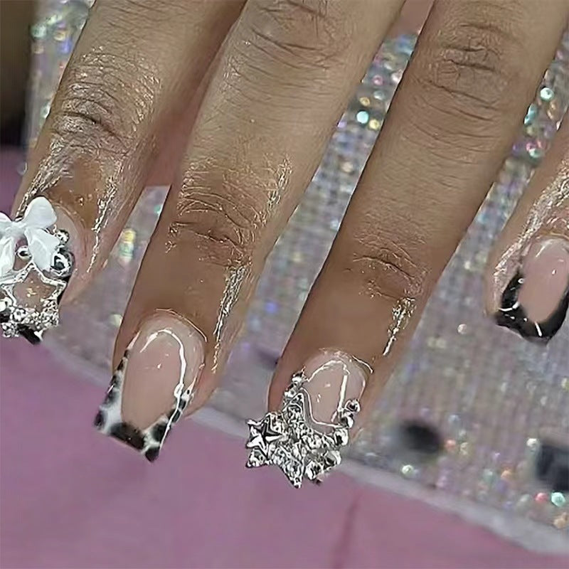 Acrylic nail set with glamorous starlights and elegant embellishments Acalora