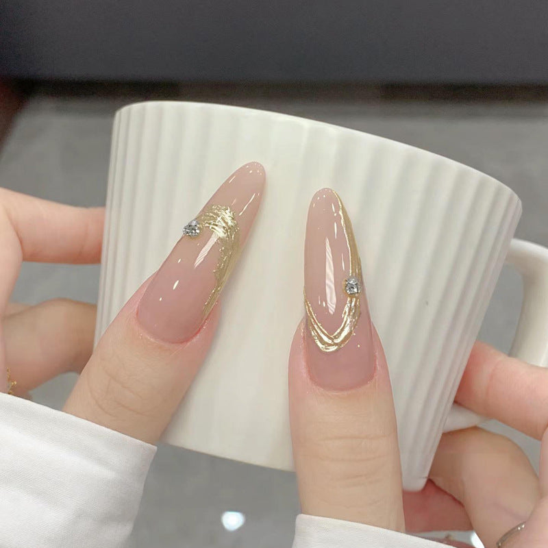 Artificial nail set with elegant gold design and sparkling applications Acalora