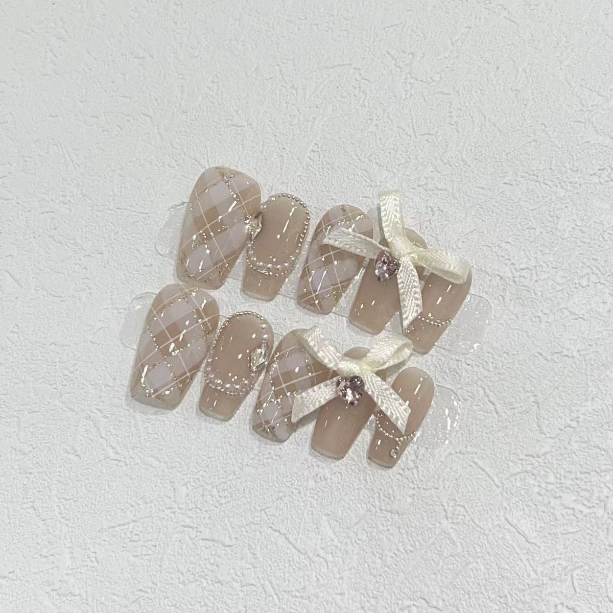Elegant Press-On Nail Art Set with Ribbons and Gemstone Accents Acalora