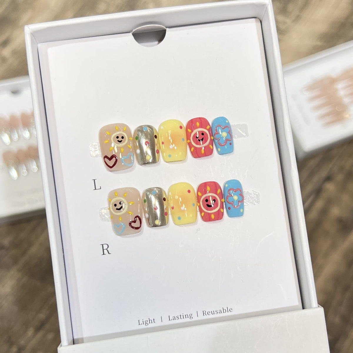 Whimsical Press-On Nail Art Set with Smiley Faces and Floral Designs Acalora