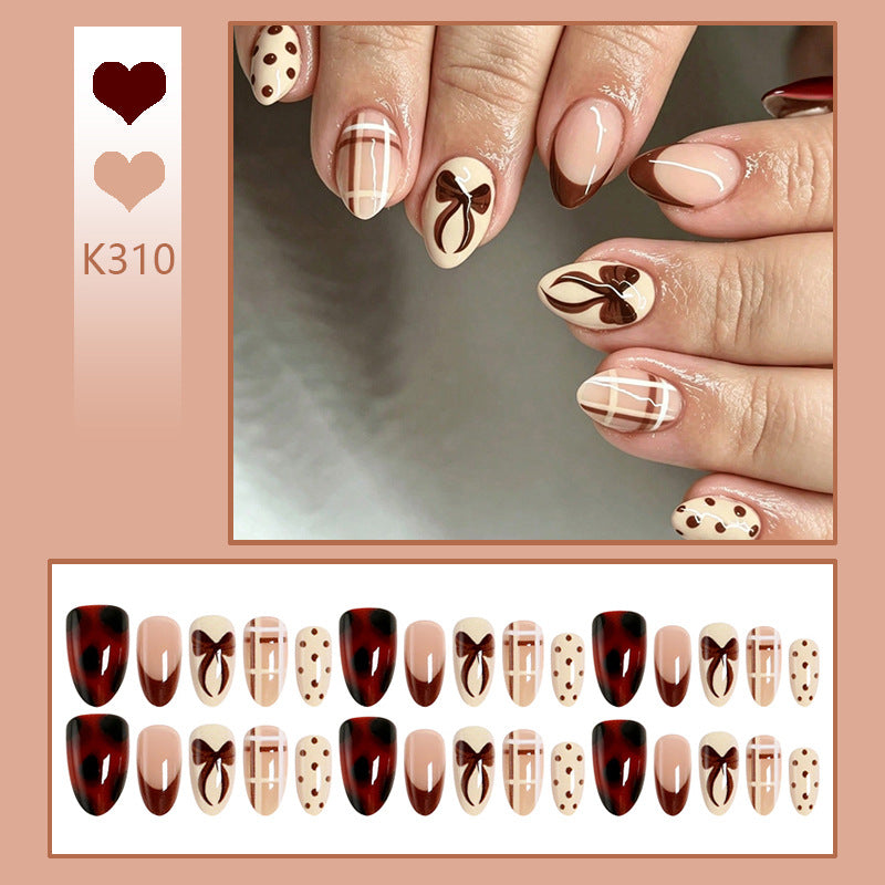 Artificial nail set with elegant bow and caramel designs Acalora