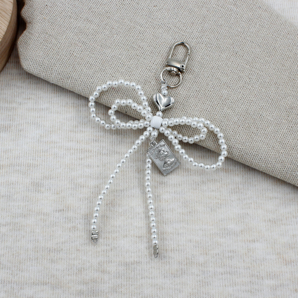 Elegant Beaded Bow Brooch Acalora