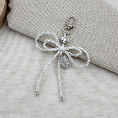 Elegant Beaded Bow Brooch Acalora