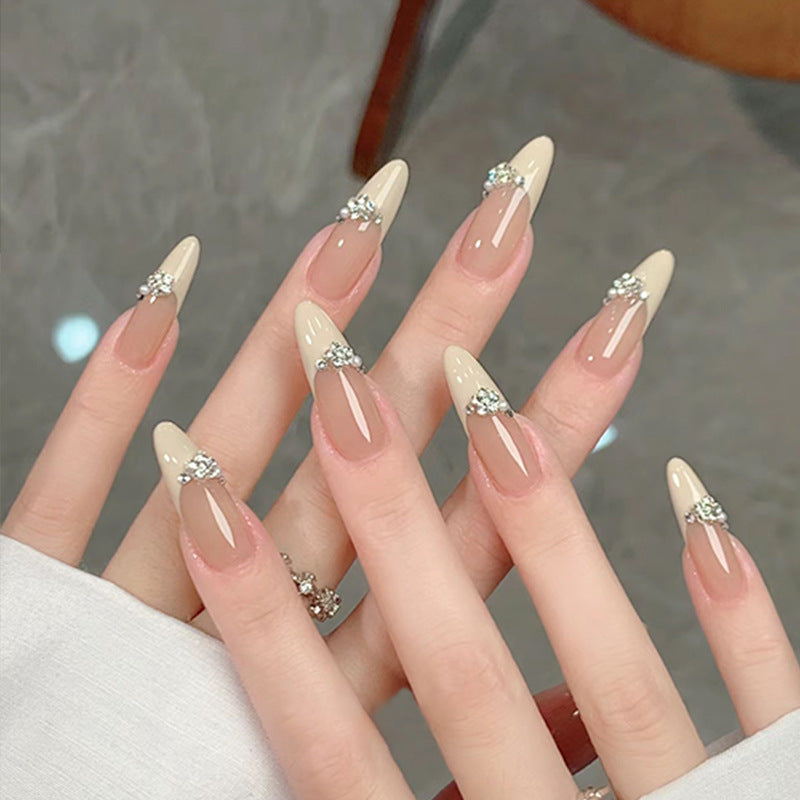 Acrylic nail set with elegant tips and sparkling appliqués Acalora