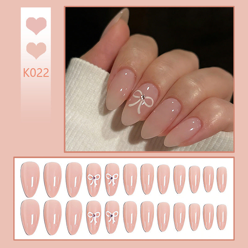 Acrylic nail set with elegant bow accents Acalora