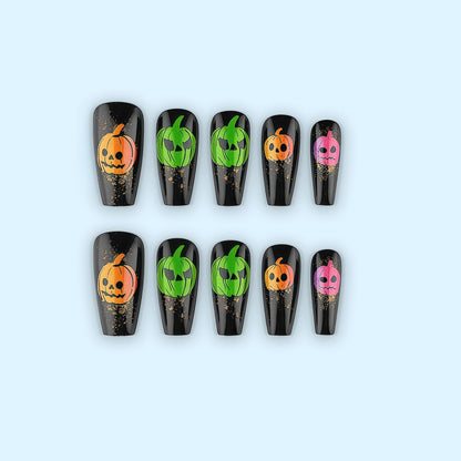 Halloween-style artificial nails with graphic pumpkin designs Acalora
